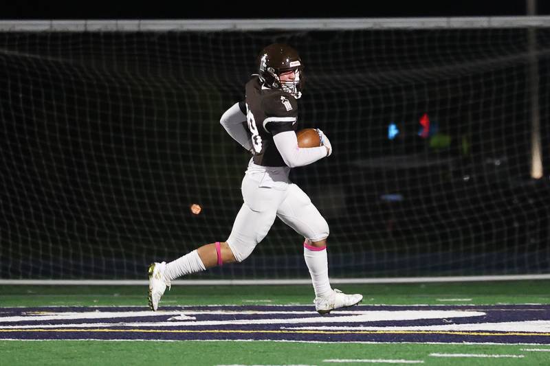 Joliet Catholic’s Nate Magrini trots in for a touchdown against Leo on Friday, Oct. 6, 2023 in Joliet.