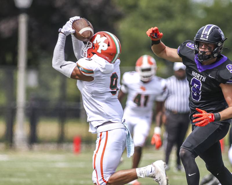 Morgan Park's Zhyil Mosley (9) comes up with an interception during football game between Downers Grove North at Morgan Park Saturday, Aug 30, 2025  in Chicago.