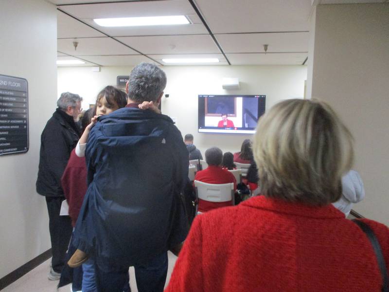 Quarry opponents stand outside a packed overflow room to view proceedings at a Will County Board meeting on Thursday, when the main topic was a quarry expansion that faced intense residential opposition.