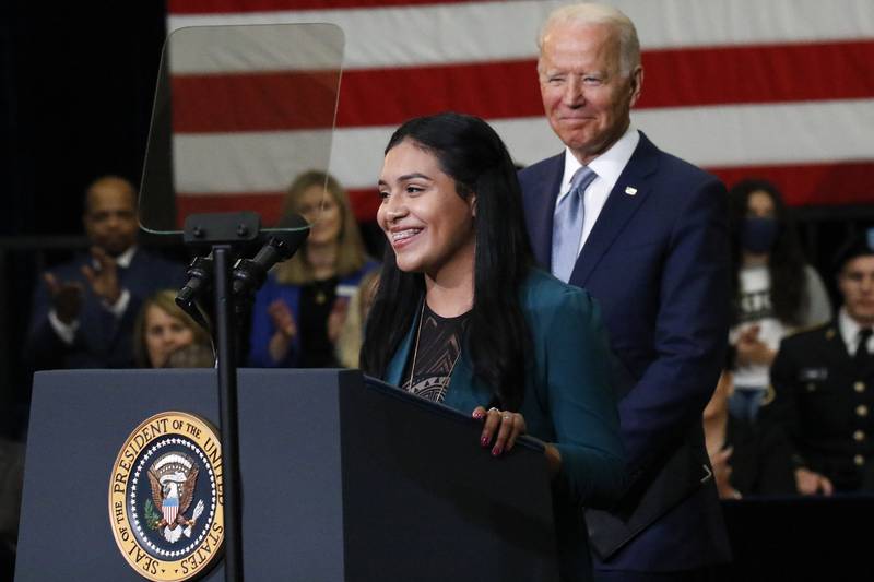 President Joe Biden listens as McHenry County College student Edith Sanchez of Harvard speaks to attendees during the president's visit to promote his "Build Back Better" agenda at McHenry County College on Wednesday, July 7, 2021, in Crystal Lake.