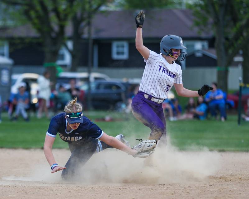 Downers Grove North's Sophia Barofsky (5) slides safely into second base during varsity softball game between Downers Grove South at Downers Grove North.  May 11, 2023.