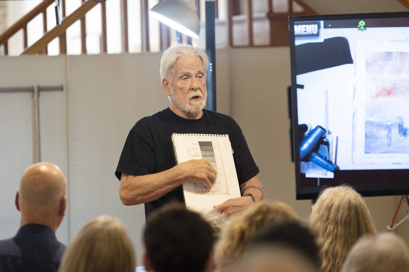 Watercolorist John Salminen goes over his grading scale while giving a presentation of the art Saturday, May 3, 2025, at The Next Picture Show.