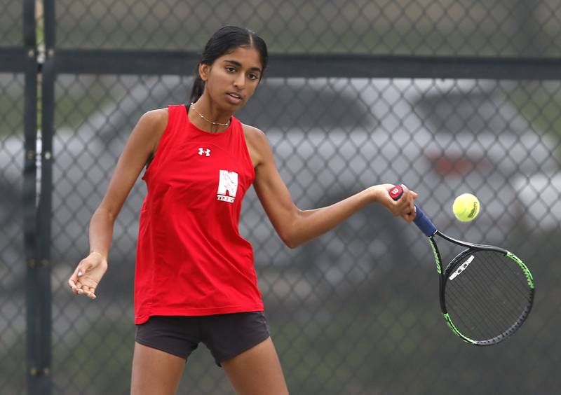 Napervile Central’s Ami Patel returns the ball Thursday, Oct. 19, 2023, during doubles match on the first day of the IHSA State Girls Tennis Tournament at Hoffman Estates High School in Hoffman Estates.