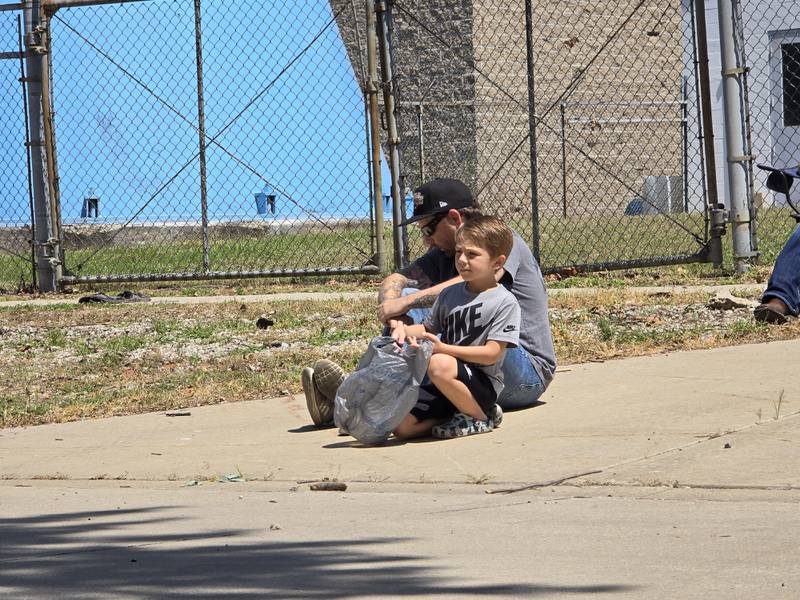 Parade spectators eagerly await Sunday, Aug. 11, 2024 for the Wenona Days Grand Parade to begin on Walnut Street.