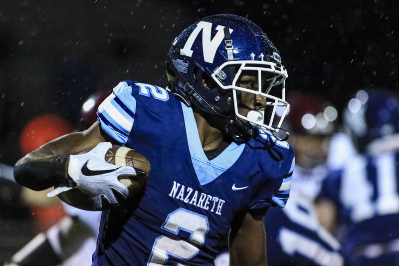 Nazareth Academy's Justin Taylor (2) runs with the ball during football game between Montini at Nazareth Academy Oct 15, 2021.