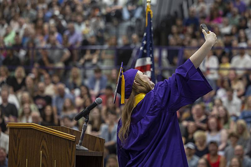 Dixon class of 2024 president Kadence Burger takes a selfie with her class Sunday, May 26, 2024 during commencement.