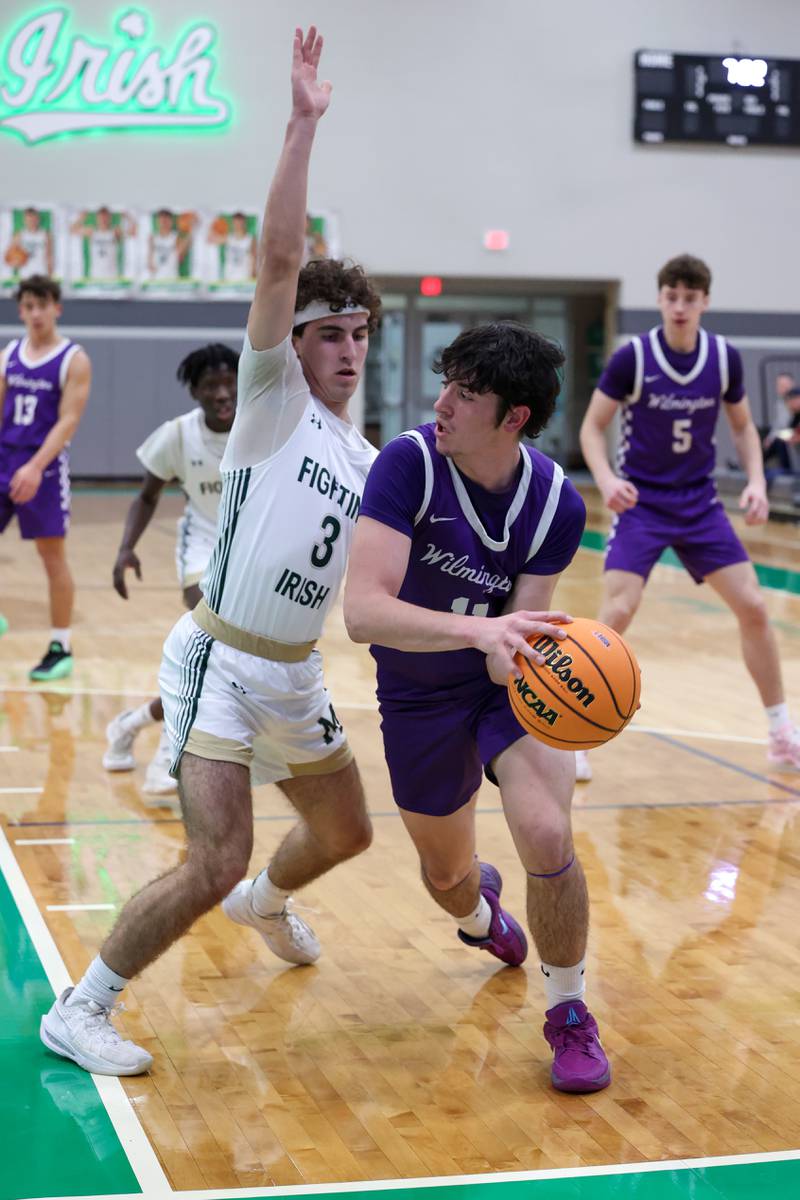 Wilmington's Ryan Kettman looks to pass around Bishop McNamara's Preston Payne during Bishop McNamara's 61-24 victory over Wilmington in the IHSA Class 2A Seneca Sectional semifinal on Tuesday, March 3, 2026.
