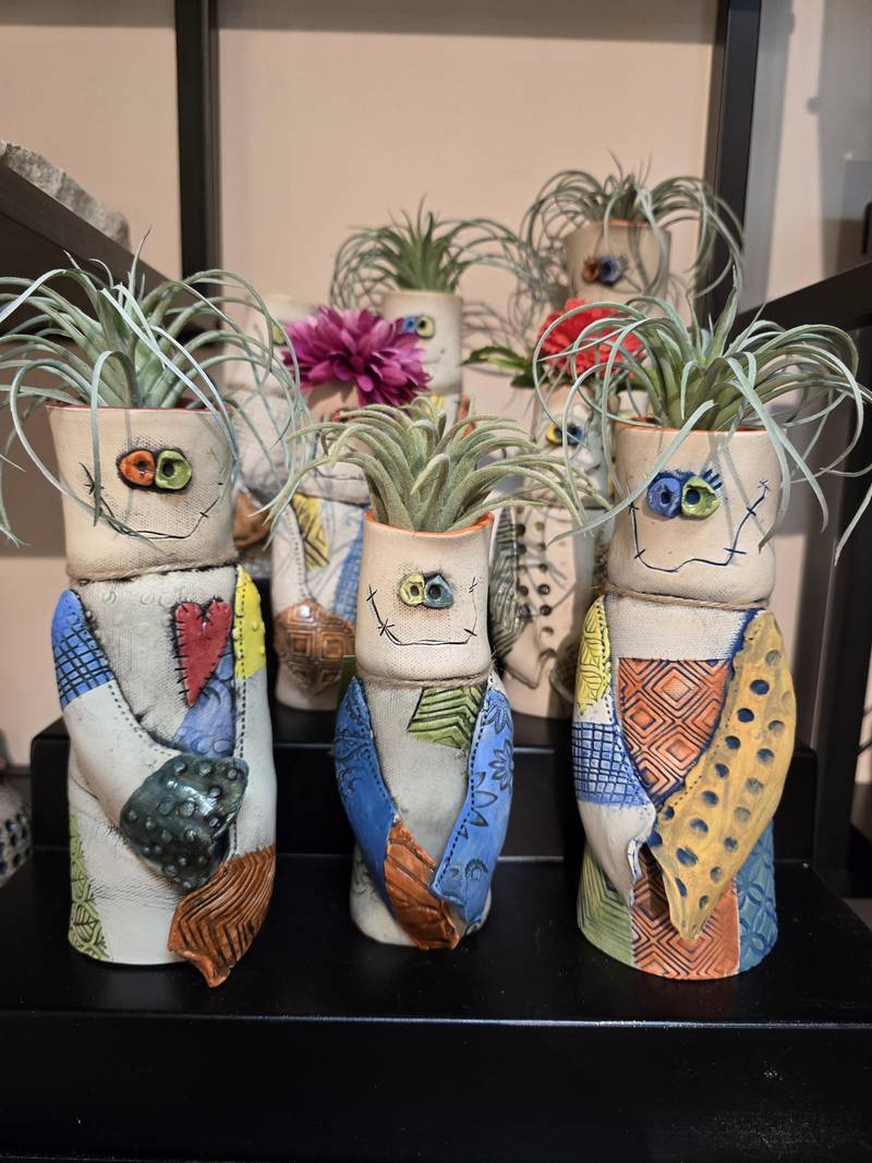 Janell Mayer has handcrafted ornaments and some holiday "uggles" for sale at the Artisans on Main in Woodstock.