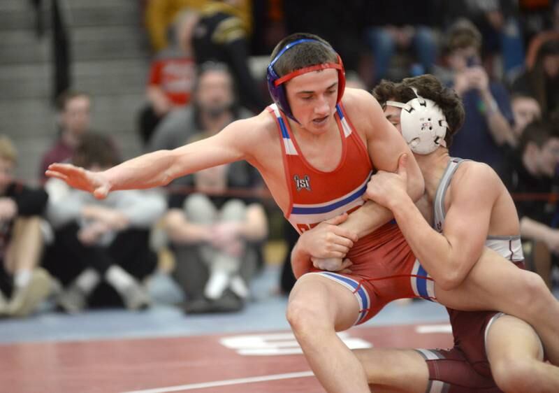 Oregon’s Nelson Benesh moves to escape Wheaton Academy’s Lincoln Hoger as they battle at 132 pounds at the 1A Oregon Sectional on Saturday, Feb. 15, 2025.