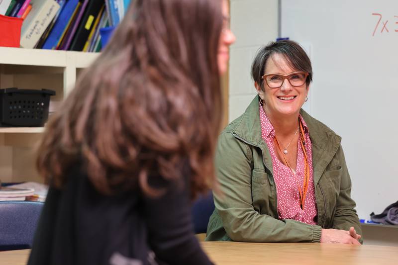 Mary Lynn Buckner, (right) longtime special education teacher at Littlejohn Elementary School in DeKalb, listens as a colleague talks Wednesday, Feb. 23, 2023, about about why Buckner is such a valuable asset to students and faculty at the school.