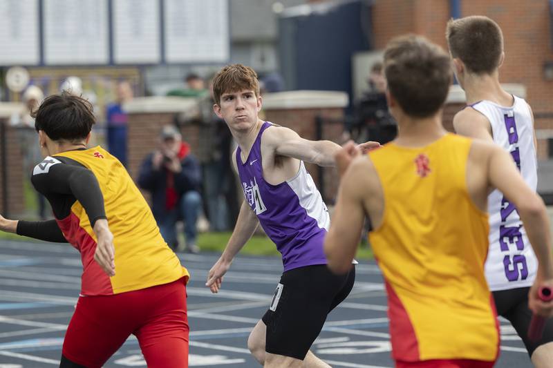 Dixon’s Keegan Shirley takes the baton for the anchor in the boys 4x8 Friday, May 2, 2025, at the Sterling Night Relays.