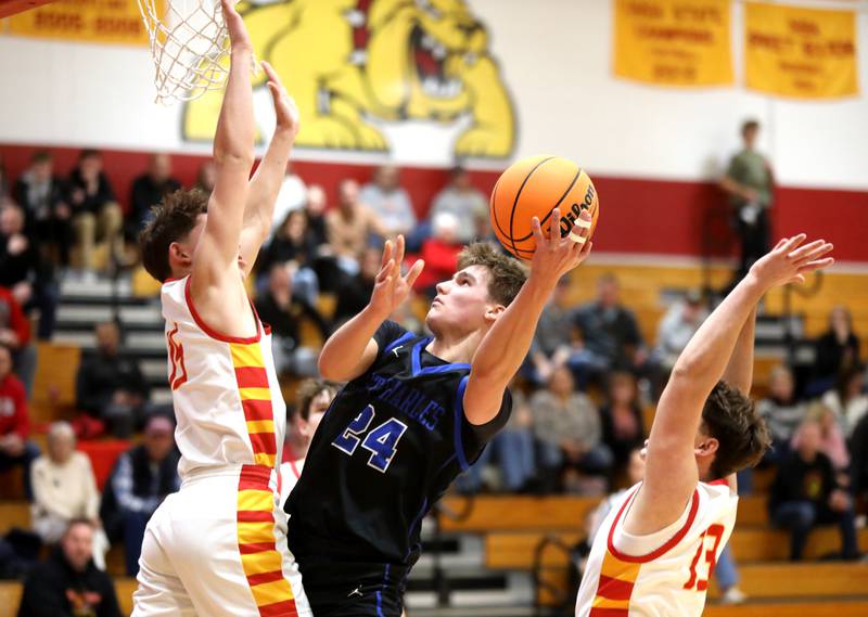 St. Charles North’s Colin Hopp shoots the ball during a game against Batavia on Wednesday, Dec. 11, 2024 in Batavia.
