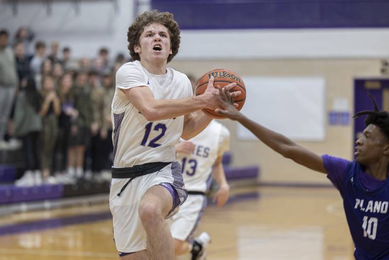 Dixon’s Jath St.Pier drives to the hoop Tuesday, Dec. 13, 2022 against Plano.