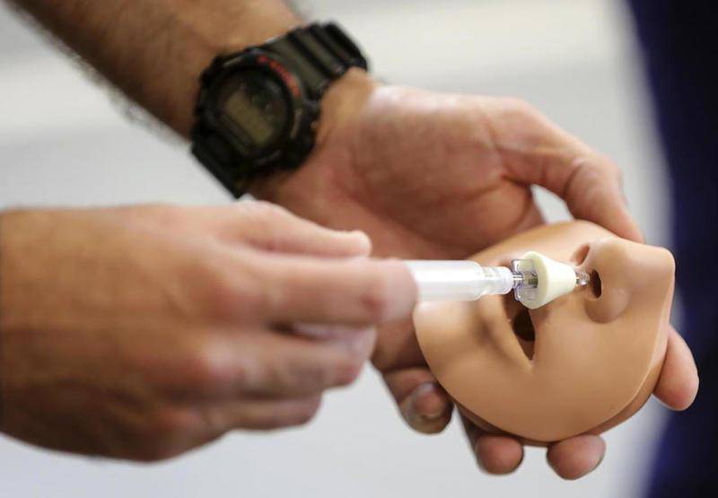 A Will County Sheriff's Deputy shows how to administer Narcan to an overdose victim in April 2016.