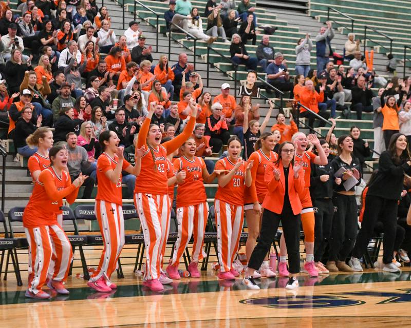 St. Charles East’s bench celebrates as the clock winds down to secure the victory over Glenbard West in the 4A Sectional championship game on Thursday Feb. 26, 2026, held at Bartlett High School.