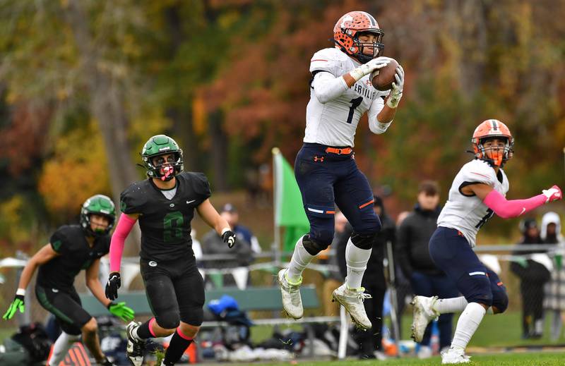 Naperville North's Cole Arl (1) goes up to receive a pass during an IHSA Class 8A playoff game against Glenbard West on Oct. 28, 2023 at Glenbard West High School in Glen Ellyn.