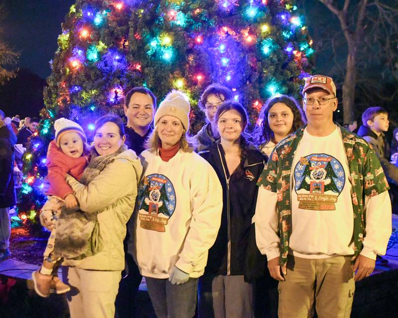 Yorkville’s Mayor John Purcell, right, poses for a photo with his family during the tree lighting ceremony on Friday Nov. 21, 2025, held at Riverfront Park in Yorkville.
