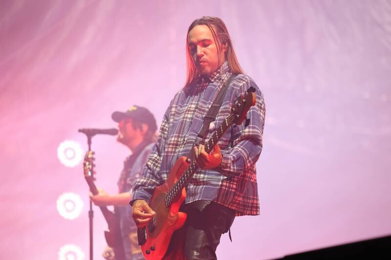 Pete Wentz of Fall Out Boy plays guitar at Riot Fest on Friday, Sept. 20, 2024 in Chicago.