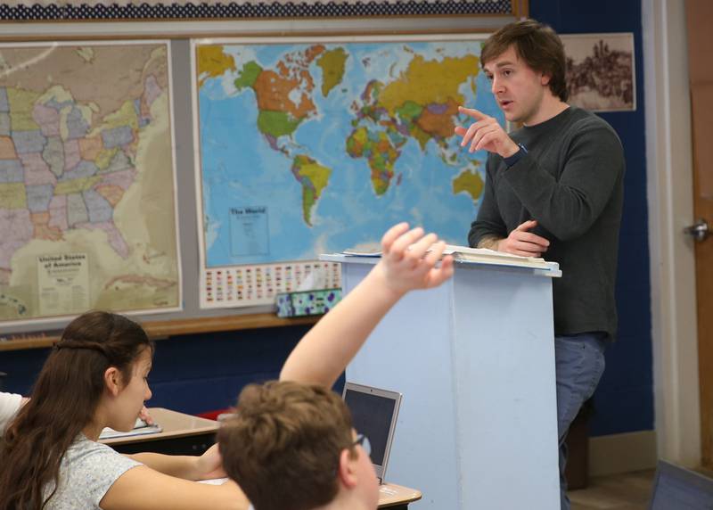 Dominic Giabozzi teaches seventh-graders at Trinity Catholic Academy on Tuesday, March 12, 2025 at Trinity Catholic Academy.