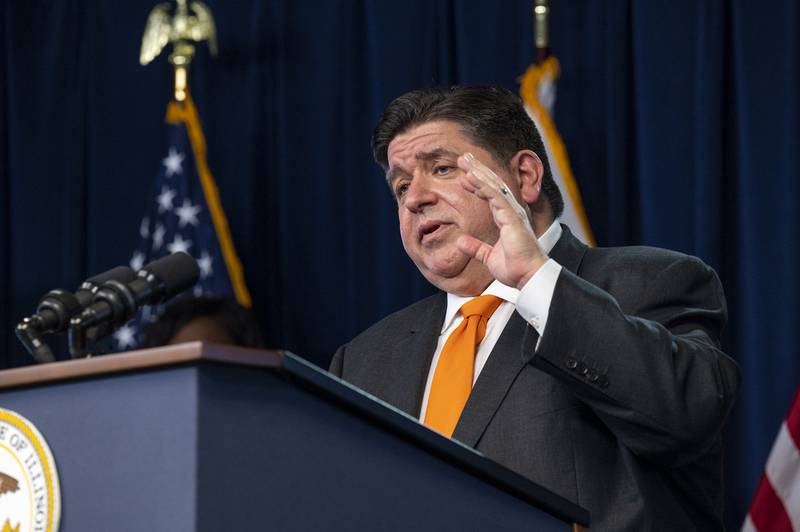 Illinois Gov. J.B. Pritzker gives a COVID-19 update to reporters in the Blue Room at the Thompson Center in Chicago, Wednesday.