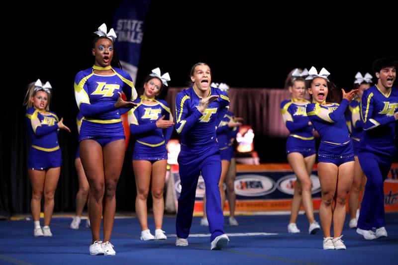 Members of the Lyons Township cheerleading team compete in the coed team division of the IHSA State Finals on Saturday, Feb. 8, 2025 at Grossinger Motors Arena in Bloomington.