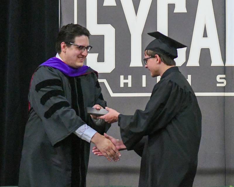Sycamore High School senior Nolan Edwards receives his diploma on Sunday, May 25, 2025, during the Class of 2025 Commencement ceremony at the high school.