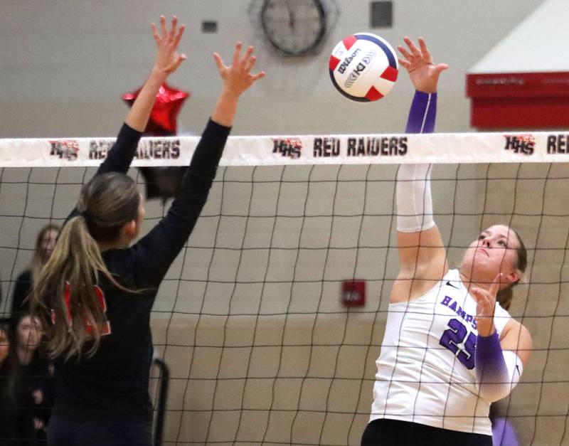 Hampshire’s Hailey Homola hits the ball Huntley’s in girls varsity volleyball at Huntley High School on Thursday, October 23, 2025.