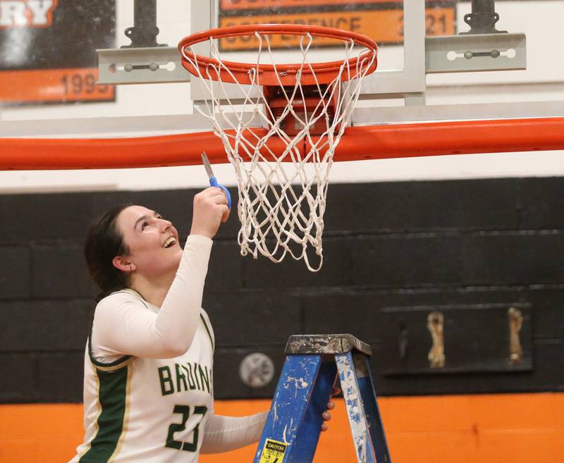 St. Bede's Ali Bosnich cuts down a piece of the net after defeating Serena in the Class 1A Sectional final game on Thursday, Feb. 22, 2024 at Gardner-South Wilmington High School.