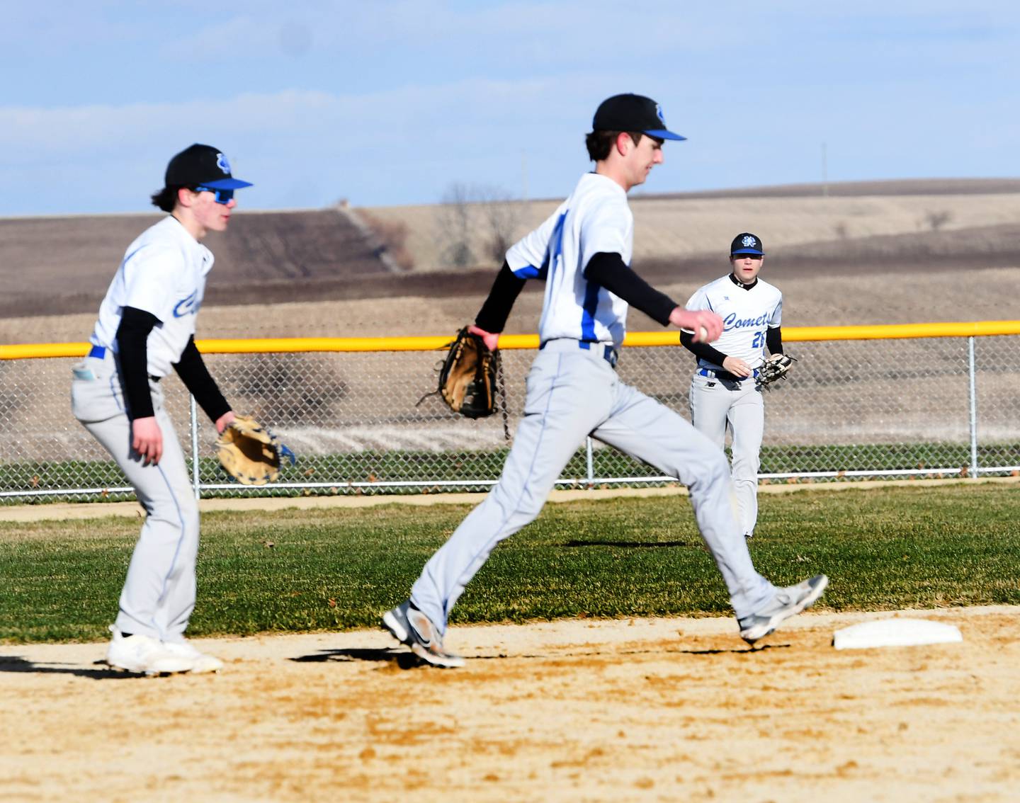 Newman shortstop Kyle Wolfe steps on second base for a force out as second baseman Garrett Matznick backs him up during a Wednesday, April 5 game with the Cardinals in Forreston.