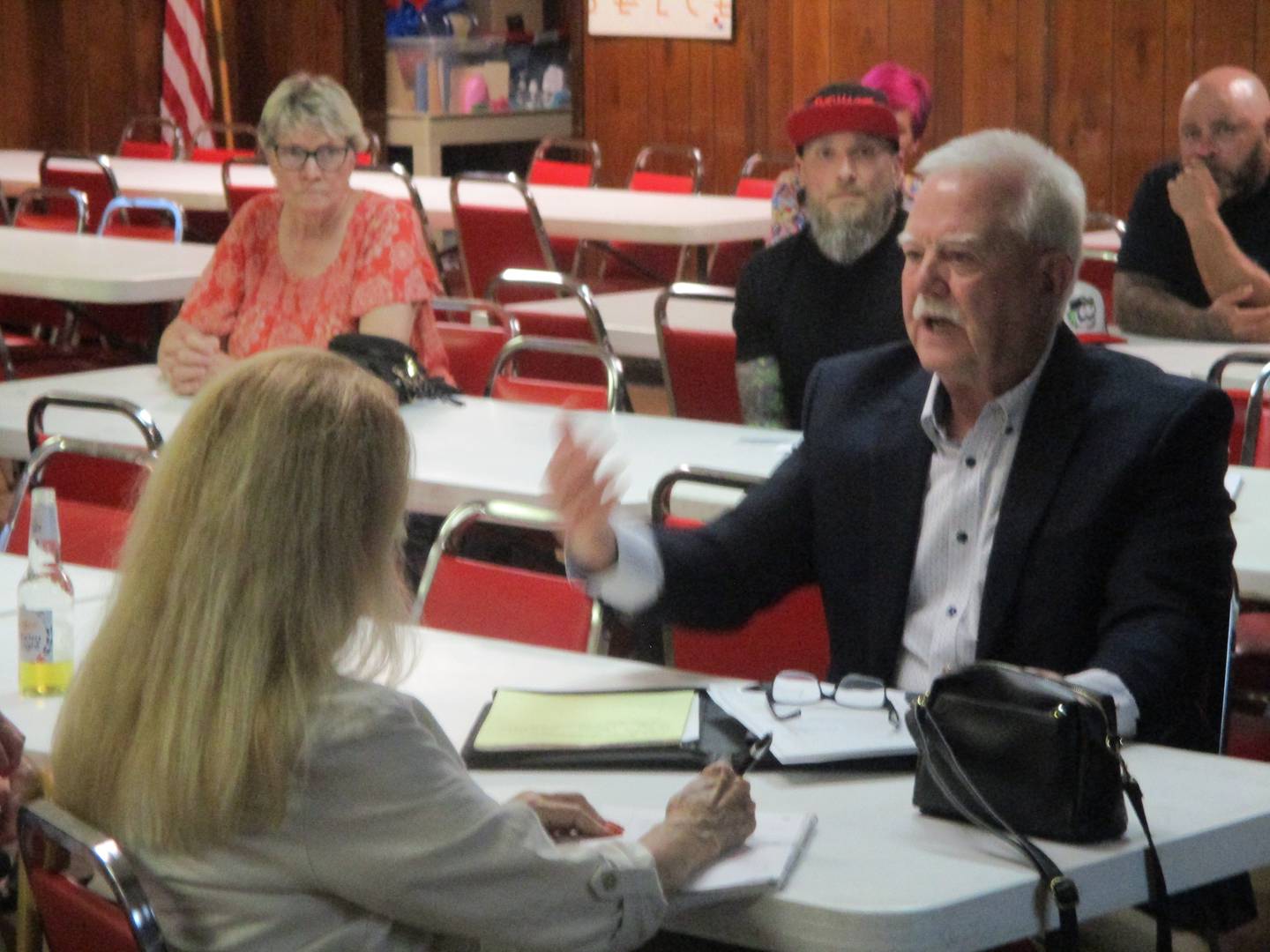 Neighborhood resident Bob Pedersen makes a point during a meeting on Wednesday to discuss plans for a stadium at Joliet Catholic Academy. June 18, 2025
