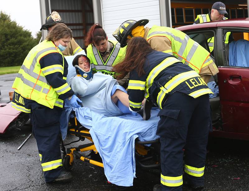 Jessica Barry a student at Leland High School, is transported by ambulance from a mock accident scene during a Mock Prom drill at Leland High School on Friday, May 6, 2022 in Leland.
