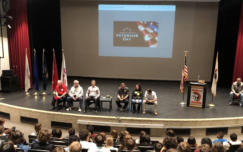 A rotating panel of veterans from across the U.S. Armed Services, conflicts, ages and genders were part of the Veterans Day observances Friday at McHenry High School Upper Campus.