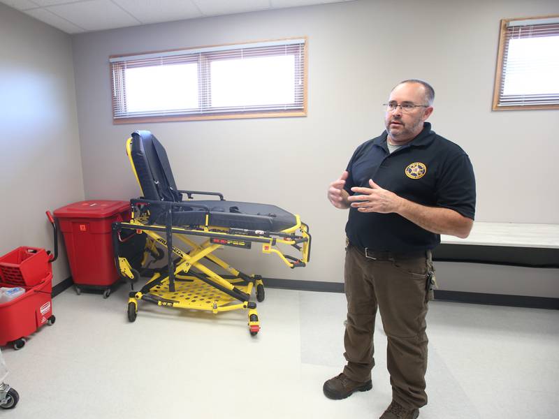 La Salle County Corner Rich Ploch, stands in the biological storage room at the La Salle County Forensic Center on Wednesday, Aug. 30, 2023 in Oglesby. The gurney area behind Ploch will eventually house a containment unit for two to four decedents, targeted for spring 2024.