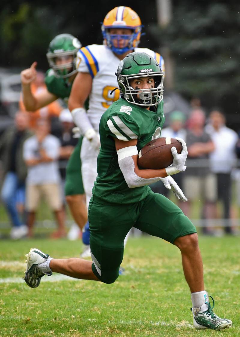 Glenbard West's Aidan Murphy (2) breaks into the open field after making a reception during a game against Lyons Township on Sep. 16, 2023 at Glenbard West High School in Glen Ellyn.