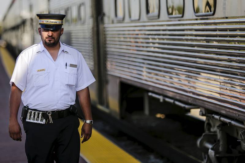 A conductor walks along the new Metra Rock Island District platform Friday, Sept. 26, 2014, in Joliet. Metra and Amtrak trains will no longer be arriving at Joliet's Union Station as construction of the new Joliet Gateway Center continues.