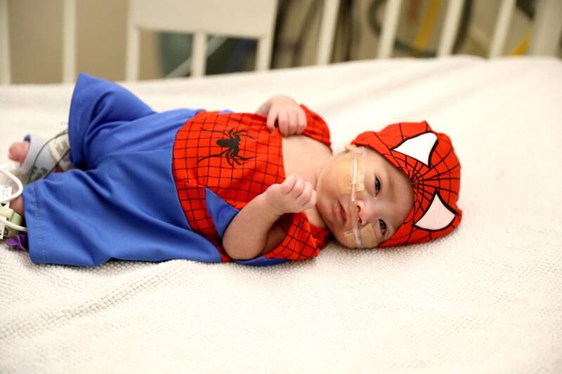 Elîas Reyes wears a Spiderman costume during Halloween in the neonatal intensive care unit of Northwestern Central DuPage Hospital in Winfield on Tuesday, Oct. 31, 2023.