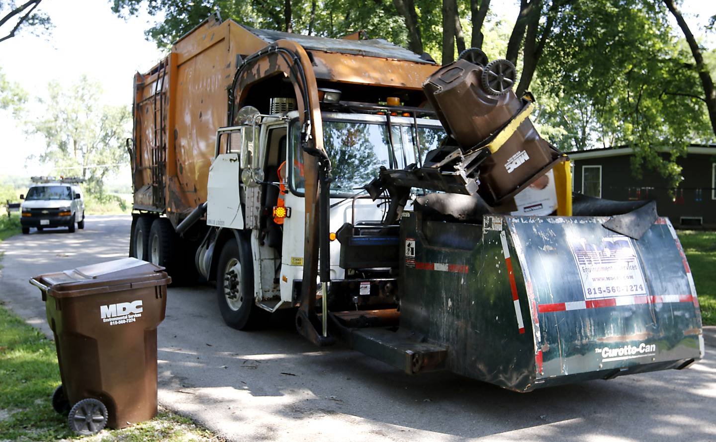 MDC Environmental Services picks up recycling on Friday, Aug. 16. 2024, along Sharon Drive in Woodstock.