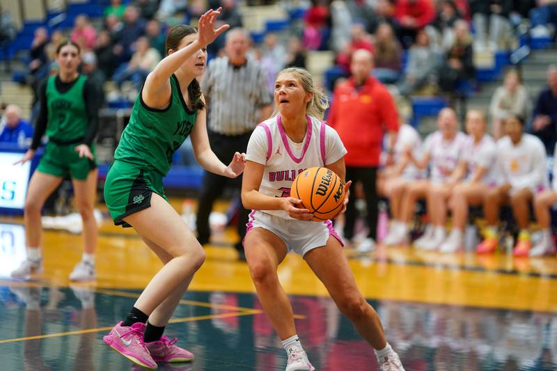 Batavia’s Natalie Warner (right), plays the ball in the paint against York's Olivia Silkaitis during a Class 4A Geneva Regional final basketball game at Geneva High School on Thursday, Feb. 20, 2025.