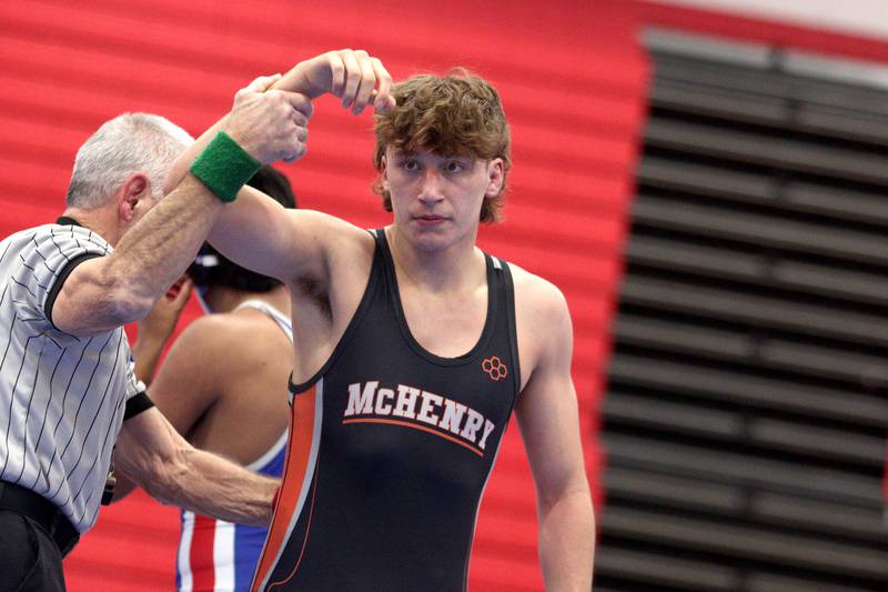 McHenry’s Pedro Jimenez is declared the winner by fall over Dundee-Crown’s Daniel Gutierrez in a 150-pound bout in varsity wrestling at Carpentersville Thursday night.