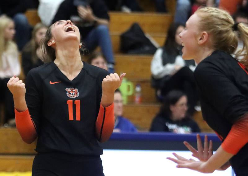 Crystal Lake Central’s Emily Mazza, left, rejoices as the Tigers close in on a two-set win over Woodstock North in IHSA girls volleyball Class 3A Regional Championship action at Woodstock High School in Woodstock on Thursday, October 30, 2025.