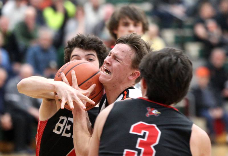 Wheaton Warrenville South’s Danny Healy (center) gets caught up on his way to the basket during a Class 4A Bartlett Sectional semifinal game against Benet on Wednesday, March 2, 2022.