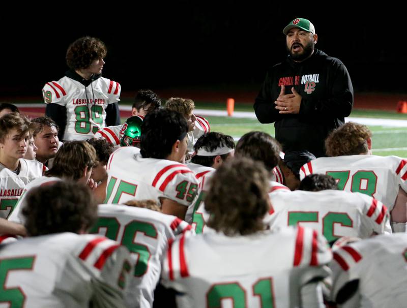 L-P head coach Jose Medina talks to his team after loosing to Morris in the Class 5A round one football game on Friday, Oct. 28, 2022 in Morris.