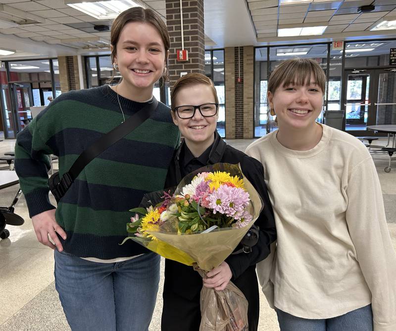 Rileigh Wren (center) poses with two of her schoolmates, Kaitlyn Moore and Claire Robers, who presented Wren with flowers after her performance with the Clinton Symphony Orchestra during the Family Concert on Sunday, Feb. 23, 2025 in the Morrison High School Auditorium.