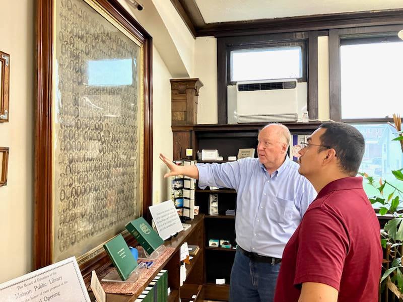 State senate candidate Li Arrelano views Thursday, Aug. 15, 2024, the Immke image of the Early Settlers of Bureau County located in the True Leaves Bookshop.