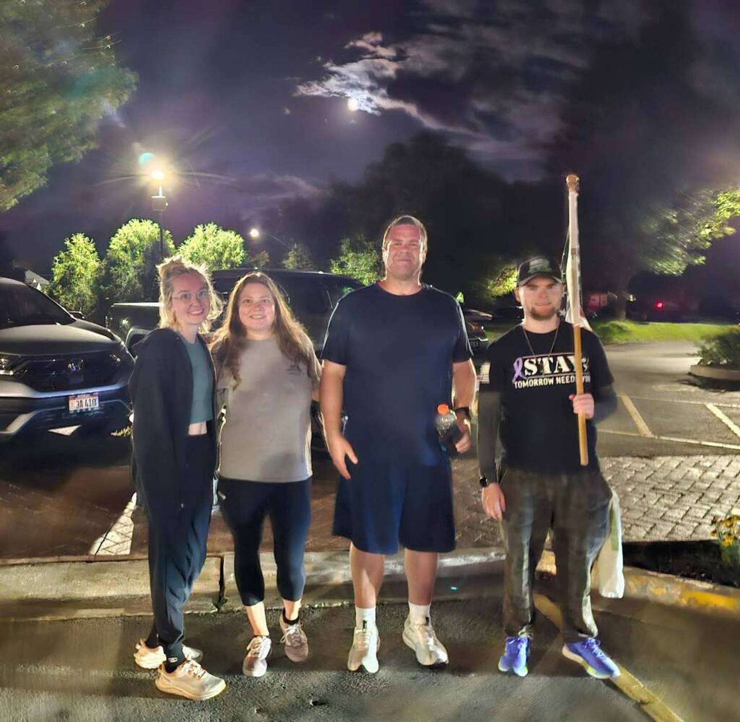 From left to right, Emily Hermann, Sandy Berry, Shaun Brav and Jake Smith pose for a photo during Smith's annual walk for mental health and suicide prevention awareness on Saturday, Sept. 6, 2025.