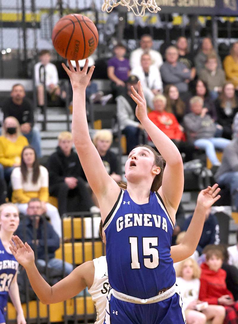 Geneva's Cassidy Arni scores in front of Sycamore's Monroe McGhee during their game Monday, Nov. 14, 2022, at Sycamore High School.