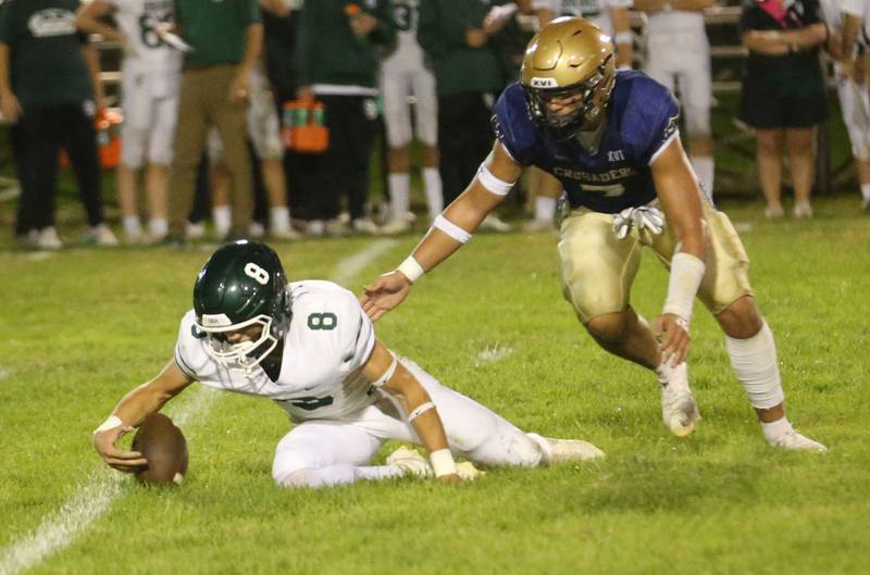 St. Bede quarterback Gino Ferrari fumbles the ball as Marquette's Blayden Cassel gets ready to tackle him on Friday, Sept. 26, 2025 at Gould Stadium in Ottawa.