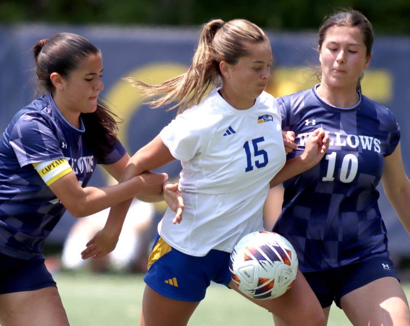 Johnsburg’s Lauren McQuiston, center, gets tied up with Willows Academy’s Teresa Keller, right, and Maria Rodriguez  in IHSA Class 1A Supersectional soccer action at Dominican University in River Forest on Saturday, May 31, 2025.