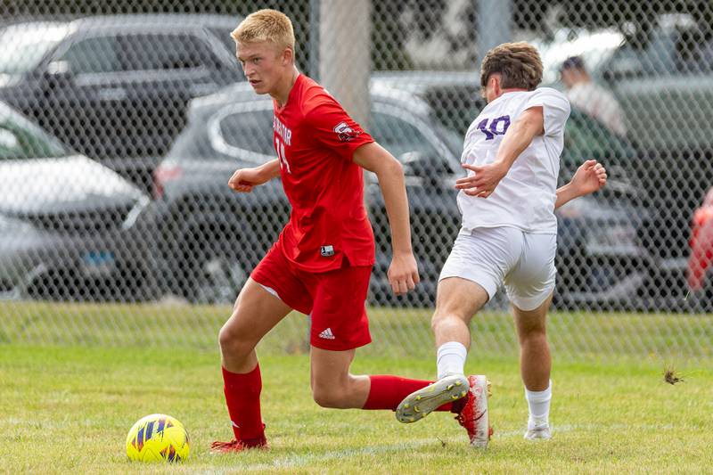 (from left) Joe Hoekstra (14) of Streator dribbles ball past Aaden Castle (19) of Mendota on Saturday, Aug 30, 2025 at the James Street Recreation Area in Streator.