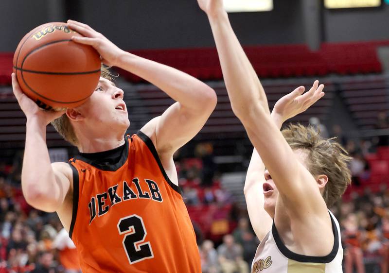 DeKalb's Sean Reynolds shoots over Sycamore's Aidan Wyzard during the First National Challenge Friday, Jan. 27, 2023, at The Convocation Center on the campus of Northern Illinois University in DeKalb.